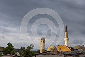 Sarajevo clock tower and minaret of Gazi Husrev bey mosque with taslihan remains and roof of bezistan