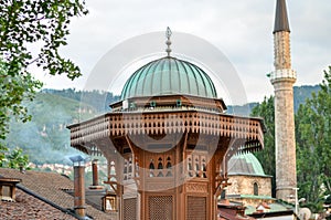 Sarajevo Sebilj and minaret photo