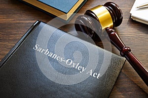 Sarbanes-Oxley act. A book with laws and gavel on the table.