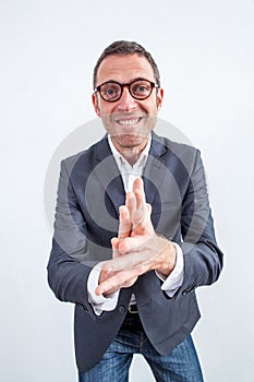 Sarcastic businessman clapping his hands for bullying revenge or success