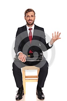 Sarcastic businessman waiting for interview making an open hand