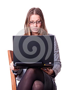Sarcastic young woman with laptop. photo