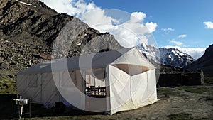 Sarchu Campting Tent with sink behide of snow mountain range in northern of India