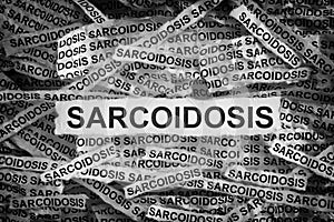 Sarcoidosis. Torn pieces of paper with the word Sarcoidosis