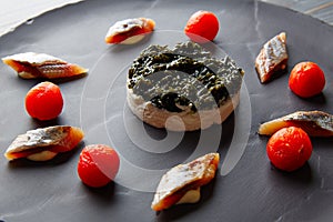 sardine with pannacotta codium and tomato photo