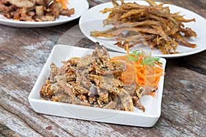 Sardines being prepared with sea salt