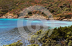 Sardinia beach with blue and light blue sea, white sand, paradise