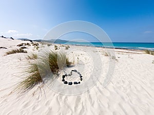 Sardinia beach of Porto Pino with love symbol