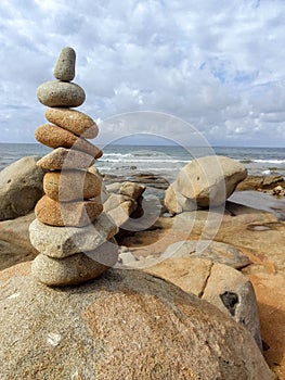 Sardinia, Italy Stones composizione in front of sea photo