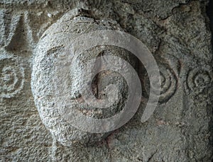 Sardinia. Mogoro. Church of the Madonna del Carmine, 14th century. Human protome carved in the left jamb of the main facade door