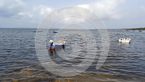 Sardinia. Portoscuso. Laguna of Bruncu Teula. Boats and spiny rush. Videoclip