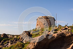 Sardinia. Portoscuso. View from the sea with the ancient Spanish Guard tower Sa Turri photo