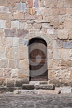 Sardinia. San Giovanni Suergiu. Palmas. Ancient Church of Santa Maria di Palmas, 11th century AD. The arched southern portal photo