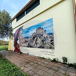 Sardinia. Siliqua. Street art. Dante Alighieri in front of the Acquafredda Castle. Murales by Pils, from 2021