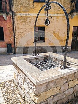 Sardinia. Tratalias. Glimpse of Tratalias Vecchia. An ancient well in the main square of the medieval village