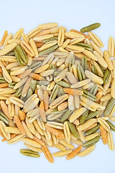 Sardinian gnocchetti pasta, also known as malloreddus or macarrones de punzu, isolated on a white background photo