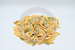 Sardinian gnocchetti pasta, also known as malloreddus or macarrones de punzu, isolated on a white background photo