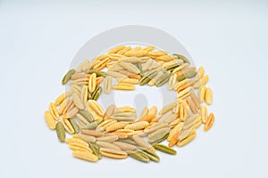 Sardinian gnocchetti pasta, also known as malloreddus or macarrones de punzu, isolated on a white background photo