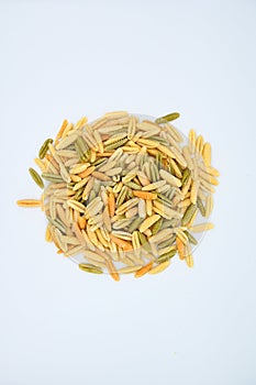 Sardinian gnocchetti pasta, also known as malloreddus or macarrones de punzu, isolated on a white background photo