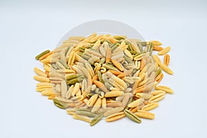 Sardinian gnocchetti pasta, also known as malloreddus or macarrones de punzu, isolated on a white background photo