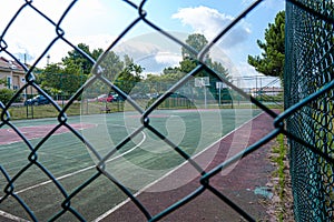 empty large football astro turf football field in Arikoy and goal net behind the fences in summer time sport entertainment concept