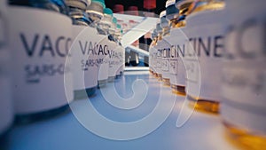 SARS-CoV-2 drug vaccine vials standing in a row on table close up