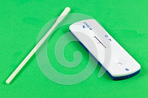 SARS-CoV-2 rapid antibody test with test swap and negative test result on green background