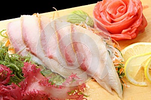 Sashimi hamachi on a board closeup