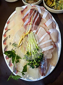 yellowtail fish sashimi with ginseng