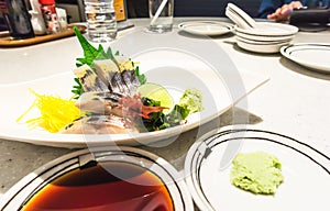 Sashimi sliced raw japanese fish dish on marble table