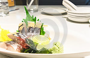 Sashimi sliced raw japanese fish dish on marble table