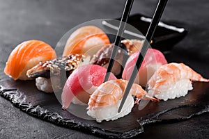 Sashimi sushi with chopsticks photo