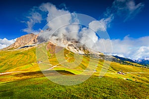 Sassolungo mountain range at sunny summer day. Dolomites mounta
