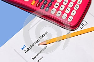 SAT admission test ticket with pencil and Calculator