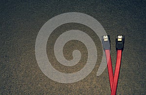 Sata computer cable on a black background.