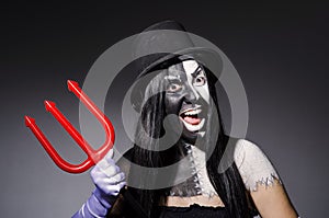 Satana woman with pitchfork photo