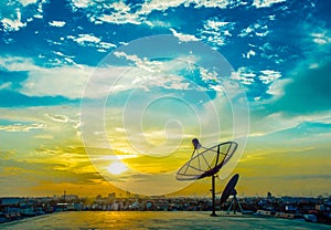 Satelite dishes with sunset photo