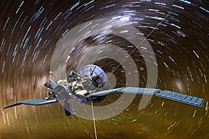 A satellite aginst star trails