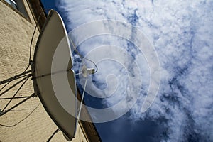 Satellite antenna on blue sky background