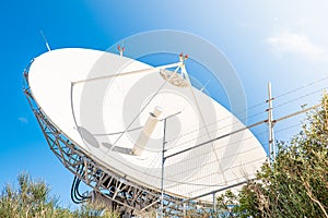 Satellite antenna for receiving and transmitting information in electromagnetic waves via satellites in orbit photo