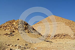 The satellite and the bent pyramids, Satellite one is located 55 meters south to the bent pyramid of king Sneferu, 26 meters in