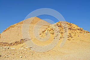 The satellite and the bent pyramids, Satellite one is located 55 meters south to the bent pyramid of king Sneferu, 26 meters in