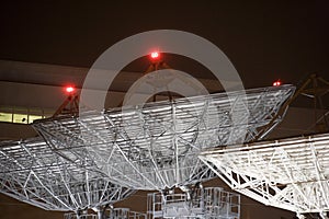 Satellite Communication Dishes at Night