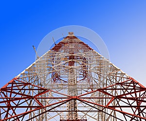 Satellite comunication signal tower with blue sky photo