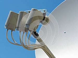 Satellite dish antenna over blue sky