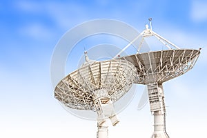 satellite dish antenna radar big size isolated on blue sky background