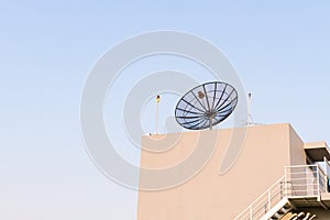 Satellite dish antenna on rooftop