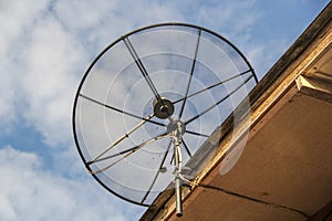 Satellite dish antenna for television on house roof