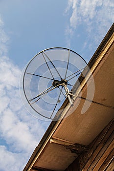 Satellite dish antenna for television on house roof