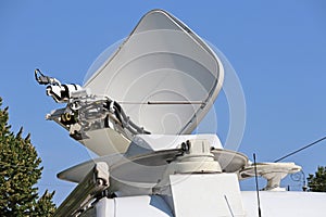 Satellite dish antenna on the top of a television car